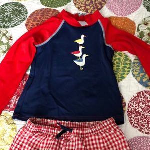 Baby Boden swim trunks and rash guard.